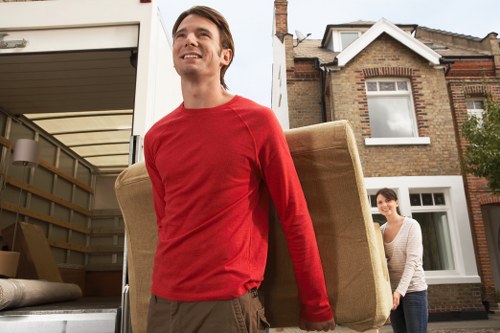 Packed office boxes and labelled items for a commercial move