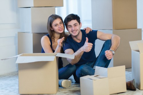 Professional movers unloading boxes and furniture at a Totteridge home