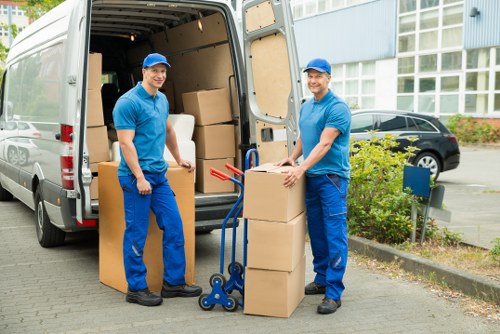 Packed moving boxes and furniture in a Totteridge home