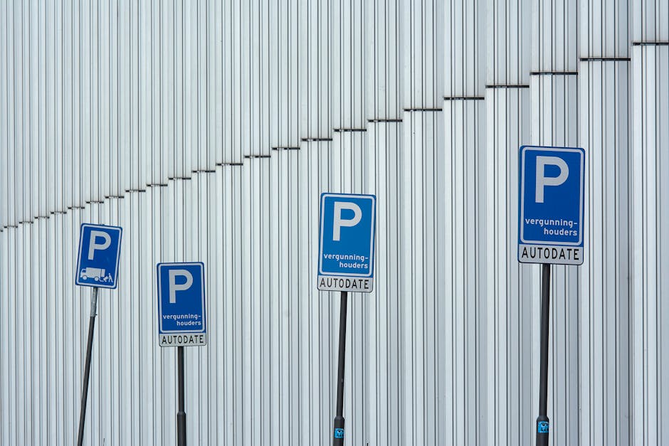 A green and white parking regulation sign mounted on a metal pole outdoors during daytime, indicating a two-hour parking limit from 8 am to 8 pm, except on Sundays. The sign is set against a backdrop of partly cloudy blue sky with green foliage visible on the left and right sides of the image. This type of parking sign is common in urban residential areas such as Totteridge, where parking restrictions are often enforced to facilitate home relocations and furniture transport. The presence of the sign suggests potential parking considerations during house removals or moving services provided by Man with Van Totteridge, who specializes in packing and loading belongings for home relocations. The image captures the sign prominently, emphasizing the importance of adhering to parking regulations when planning to load or unload household items, furniture, and boxes from a van or vehicle at residential properties in the area.
